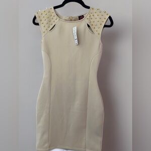 Bebe beige dress with gold studded detailing.